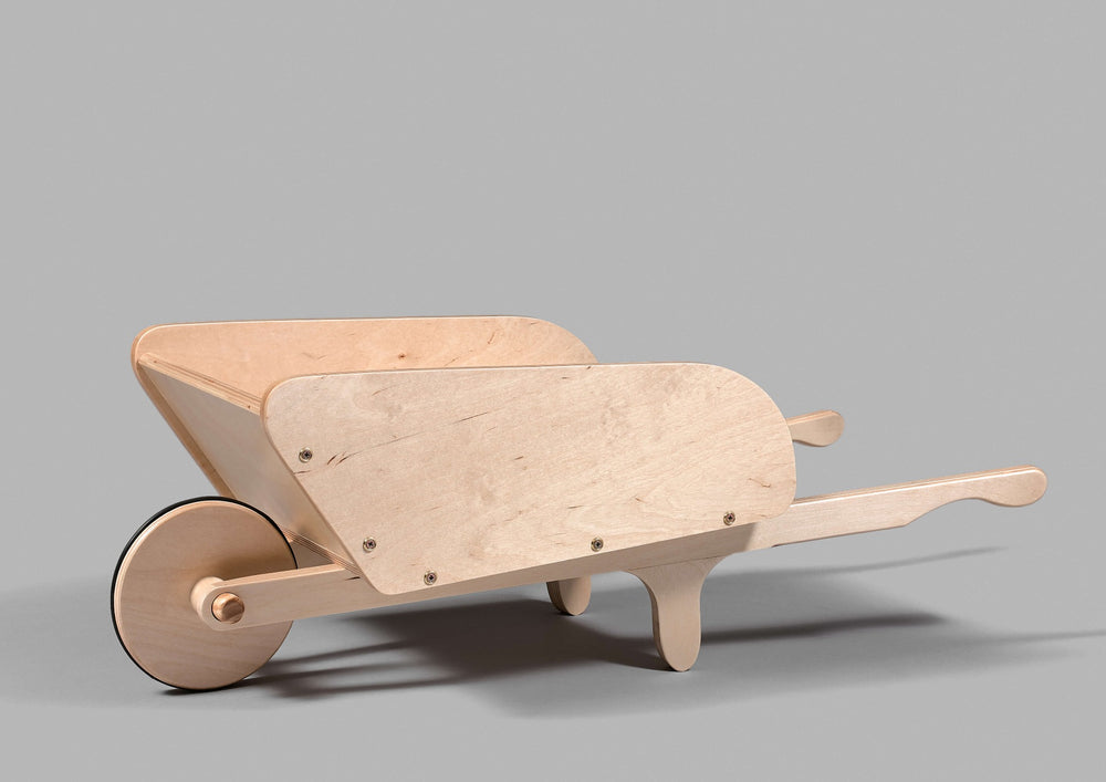 the wooden wheelbarrow allows the child to have a more confident walk, sold on artmontessori.ca